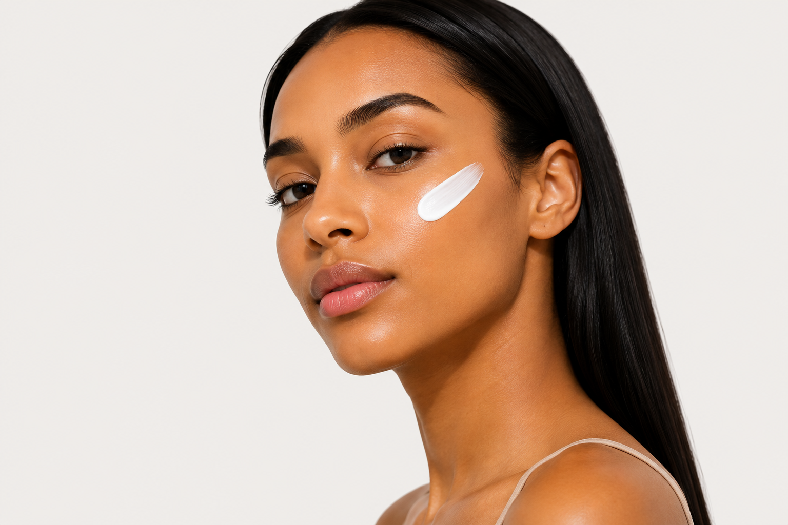 Model wearing BaseLife Clear UV Defense SPF50 sunscreen with an invisible finish.